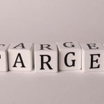 White cubes spelling 'TARGET' on a neutral background, ideal for business or marketing concepts.